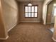 Spacious dining room with carpet flooring and a large window with shutters at 602 Lochsmere Ln, Orlando, FL 32828