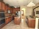 Well-equipped kitchen featuring custom cabinets, an island, and modern appliances at 602 Lochsmere Ln, Orlando, FL 32828