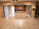 Open floorplan featuring an archway to the kitchen and eat in dining area with tile flooring at 602 Lochsmere Ln, Orlando, FL 32828