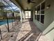 Paver patio with a screened-in pool area at 602 Lochsmere Ln, Orlando, FL 32828