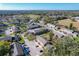 Scenic aerial view of townhouse community, showcasing manicured lawns, mature trees, and proximity to park and green spaces at 606 Casa Park I Court, Winter Springs, FL 32708