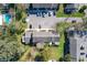 Aerial view of a house showing lawn, parking, and a community pool at 606 Casa Park I Court, Winter Springs, FL 32708