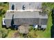 Aerial view of the house with the roof, lawn, and parking at 606 Casa Park I Court, Winter Springs, FL 32708