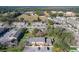 Aerial view of well-maintained townhomes with parking, landscaping, and nearby recreational areas at 606 Casa Park I Court, Winter Springs, FL 32708