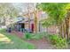 Back exterior view with mature landscaping and patio at 606 Casa Park I Court, Winter Springs, FL 32708