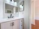 Bathroom featuring a modern vanity with matte black fixtures and a well-lit mirror at 606 Casa Park I Court, Winter Springs, FL 32708