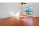 Bright bedroom featuring a large window and ceramic tile flooring at 606 Casa Park I Court, Winter Springs, FL 32708