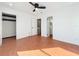 Bright bedroom featuring terra cotta tile, ceiling fan and access to bathroom at 606 Casa Park I Court, Winter Springs, FL 32708