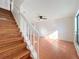 View of stairs to the second level from a living room with ceramic tile flooring at 606 Casa Park I Court, Winter Springs, FL 32708