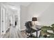 Hallway with a small desk and chair near a bedroom door, and light colored wood floors at 6132 Saint Julian Dr, Sanford, FL 32771