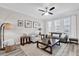 Comfortable living room featuring neutral colors, modern decor, and plenty of natural light from the large windows at 6132 Saint Julian Dr, Sanford, FL 32771