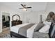 Bright main bedroom with king bed, ceiling fan, walk-in closet, and ensuite bathroom at 6132 Saint Julian Dr, Sanford, FL 32771