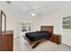 Comfortable bedroom with neutral colors and a ceiling fan at 632 Tranquil Oaks Ln, Oviedo, FL 32765