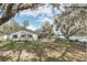 Charming home with white picket fence and scenic lake views at 632 Tranquil Oaks Ln, Oviedo, FL 32765