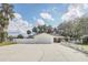 Charming single-story home with a white picket fence and well-manicured lawn at 632 Tranquil Oaks Ln, Oviedo, FL 32765