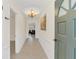 Bright hallway featuring tile floors, a decorative ceiling medallion and neutral wall paint at 632 Tranquil Oaks Ln, Oviedo, FL 32765