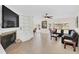 Spacious living room with fireplace, built-in shelving, and neutral ceramic tile floors at 632 Tranquil Oaks Ln, Oviedo, FL 32765