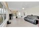 Bright living room with tile floors and a view of the outdoors at 632 Tranquil Oaks Ln, Oviedo, FL 32765