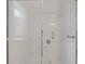 Bright and clean shower with white tiled walls and glass doors at 632 Tranquil Oaks Ln, Oviedo, FL 32765