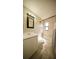 Well-lit bathroom featuring a shower-tub combo, vanity, and neutral tiling at 702 Apricot Dr, Ocoee, FL 34761