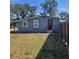 Exterior view of single-story home with a fenced backyard and mature trees at 723 Jeffcoat St, Apopka, FL 32703