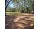 Spacious lot with mature trees offers privacy at 723 Jeffcoat St, Apopka, FL 32703