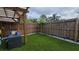 A backyard with a pergola and artificial turf at 7411 Golden Glenn Ct, Orlando, FL 32807