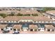 Exterior view of townhomes with private patios and garages under terracotta tile roofs at 8948 Adriatico Ln, Kissimmee, FL 34747