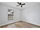 Bedroom featuring sleek floors, natural lighting, and minimalist design at 9913 Peddlers Way, Orlando, FL 32817