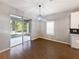 Dining space with sliding doors to screened-in porch and views of backyard at 1038 Commuter Dr, Deltona, FL 32738