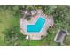 Aerial view of a large, sparkling pool at a condo community with lounge chairs at 1060 Lotus Pkwy # 1012, Altamonte Springs, FL 32714