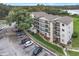 An aerial view of the condo building, parking, and landscaping at 1060 Lotus Pkwy # 1012, Altamonte Springs, FL 32714