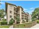 Inviting multi-story condo building featuring multiple balconies and well-maintained landscaping at 1060 Lotus Pkwy # 1012, Altamonte Springs, FL 32714