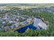 Overhead view of homes near a lake, showcasing the tranquil setting and community layout at 1112 Heron Point Way, Deland, FL 32724