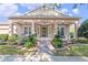 Inviting front porch with decorative landscaping and a brick walkway leading to the front door at 1112 Heron Point Way, Deland, FL 32724