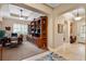 Study featuring custom built-in bookshelves, a desk, and an abundance of natural light at 1112 Heron Point Way, Deland, FL 32724