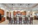 Gourmet kitchen with a large island, custom cabinetry, and pendant lighting at 1112 Heron Point Way, Deland, FL 32724