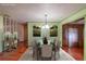 Virtually staged dining room featuring stylish decor, elegant lighting, and a comfortable seating arrangement at 1221 Forest Cir, Altamonte Springs, FL 32714