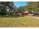 Charming one-story home featuring a colorful brick facade and a well-maintained lawn, offering a welcoming curb appeal at 1221 Forest Cir, Altamonte Springs, FL 32714