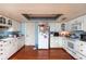 Bright kitchen featuring white cabinets, a laminate countertop, and essential appliances, perfect for everyday cooking at 1221 Forest Cir, Altamonte Springs, FL 32714