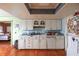 Well-lit kitchen with classic white cabinetry and an open layout, offering a practical space for culinary endeavors at 1221 Forest Cir, Altamonte Springs, FL 32714