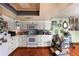 Functional kitchen featuring white cabinets and laminate countertops, ready for a personal design touch at 1221 Forest Cir, Altamonte Springs, FL 32714