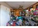 Cluttered storage room with shelves, boxes, and personal items at 1221 Forest Cir, Altamonte Springs, FL 32714