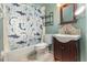 Cozy bathroom with shower/tub combination and a shark themed shower curtain at 12972 Broakfield Cir, Orlando, FL 32837