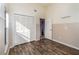 Bedroom with wood-look floors, neutral wainscoting and a double door closet at 12972 Broakfield Cir, Orlando, FL 32837