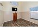 Bedroom featuring wood-look floors and a media cabinet at 12972 Broakfield Cir, Orlando, FL 32837