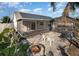 Enclosed patio featuring a stone surround, dark roof and comfortable seating, perfect for outdoor relaxation at 12972 Broakfield Cir, Orlando, FL 32837