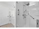 Bathroom features a glass enclosed shower and safety bars at 12991 Sw 72Nd Terrace Rd, Ocala, FL 34473