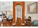 Dining room with wood floors and arched entryways leading to other rooms at 12991 Sw 72Nd Terrace Rd, Ocala, FL 34473