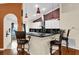 Modern kitchen featuring black countertops and stylish pendant lighting over the breakfast bar at 12991 Sw 72Nd Terrace Rd, Ocala, FL 34473